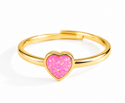 A gold-plated open bangle ring featuring a heart-shaped pink glitter inlay, shown on a clean white background.