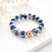 The Camille Chinoiserie Painted Bead Stretchy Bracelet with Brushed Gold Ball - Blue Two Tone Colorway