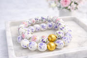 The Camille Chinoiserie Painted Bead Stretchy Bracelet with Brushed Gold Ball - Pink & Lilac Floral