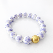 The Camille Chinoiserie Painted Bead Stretchy Bracelet with Brushed Gold Ball - Lilac Floral