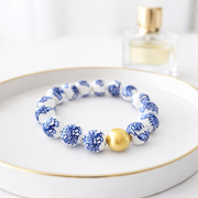 The Camille Chinoiserie Painted Bead Stretchy Bracelet with Brushed Gold Ball - Blue Two Tone Colorway