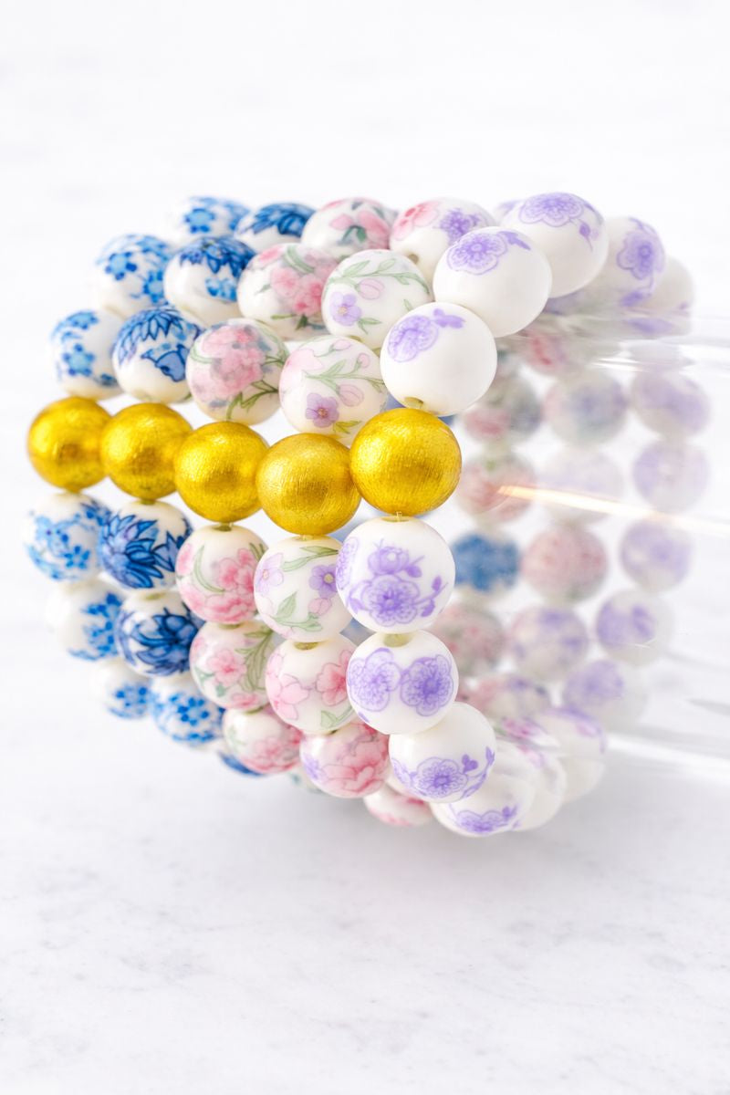 The Camille Chinoiserie Painted Bead Stretchy Bracelet with Brushed Gold Ball - Blue Two Tone Colorway