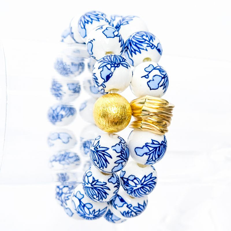The Camille Chinoiserie Painted Bead Stretchy Bracelet with Brushed Gold Ball - Blue Two Tone Colorway