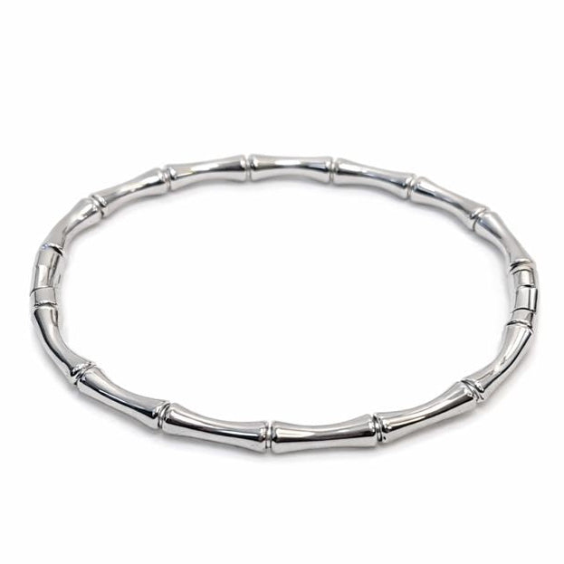 Silver bracelet with a bamboo design on a white background