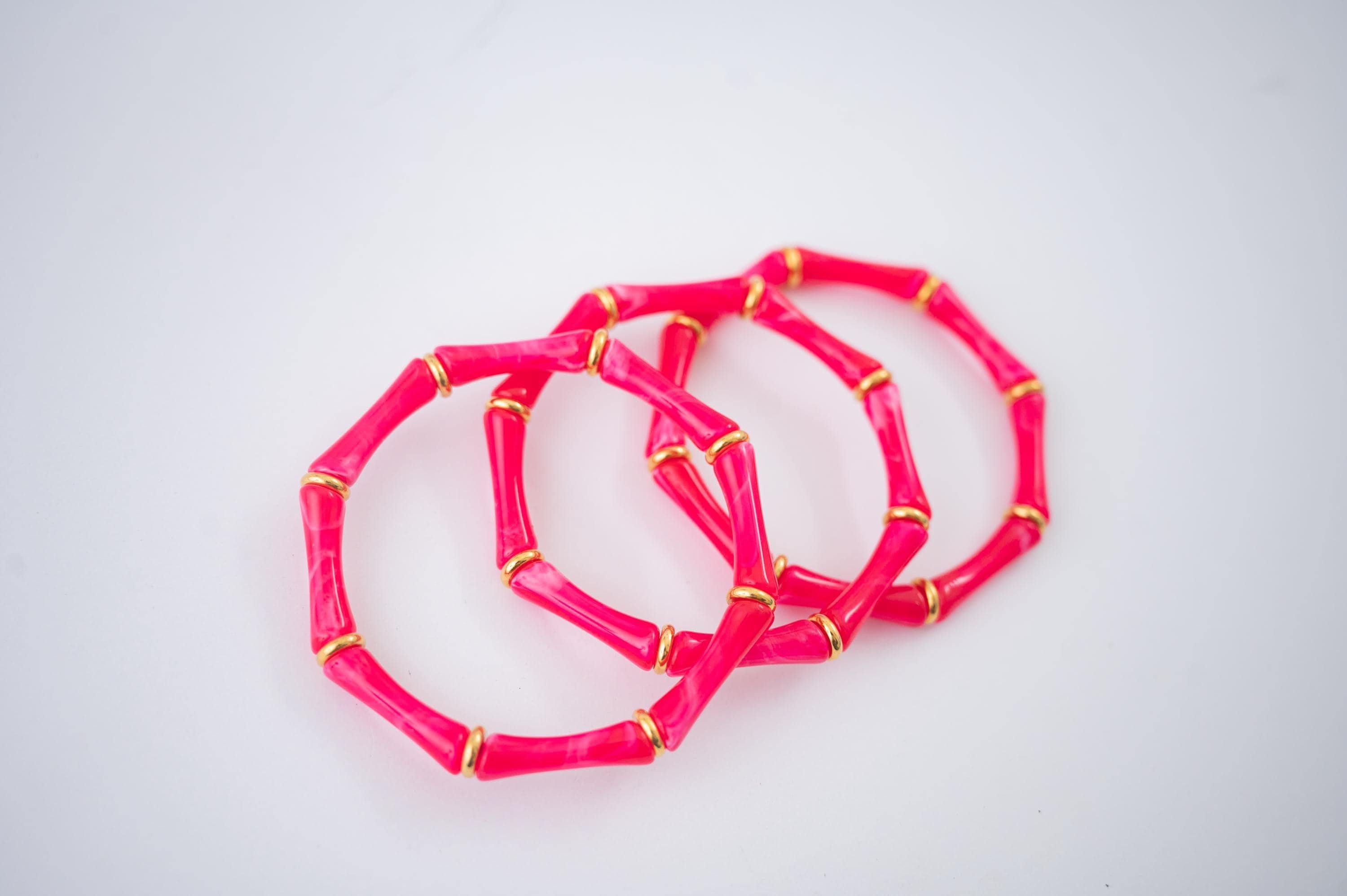 The Thin Bridgette Bamboo Acrylic Bangle Set in Marbled Hot Pink (in Gold or Silver)