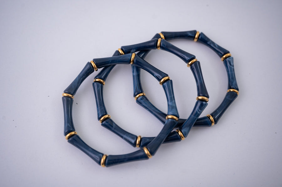 The Thin Bridgette Bamboo Acrylic Bangle Set in Marbled Navy (in Gold or Silver)