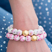 The Camille Chinoiserie Painted Bead Stretchy Bracelet with Brushed Gold Ball - Pink & Lilac Floral