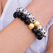 The Alouette Black Stone Bead Stretchy Bracelet with Brushed Gold Ball