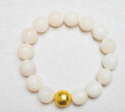 The Alouette White Stone Bead Stretchy Bracelet with Brushed Gold Ball