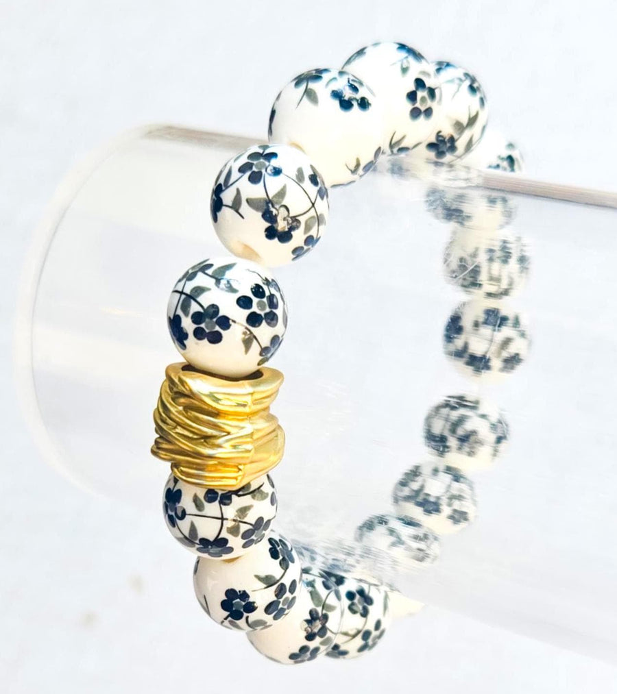 The Camille Chinoiserie Painted Bead Stretchy Bracelet with Brushed Gold Ball - Black Floral