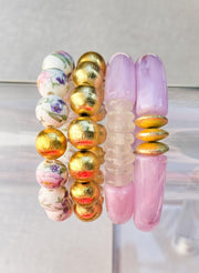 The Camille Chinoiserie Painted Bead Stretchy Bracelet with Brushed Gold Ball - Pink & Lilac Floral