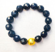 The Alouette Black Stone Bead Stretchy Bracelet with Brushed Gold Ball
