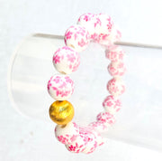 The Camille Chinoiserie Painted Bead Stretchy Bracelet with Brushed Gold Ball - Dark Pink Floral