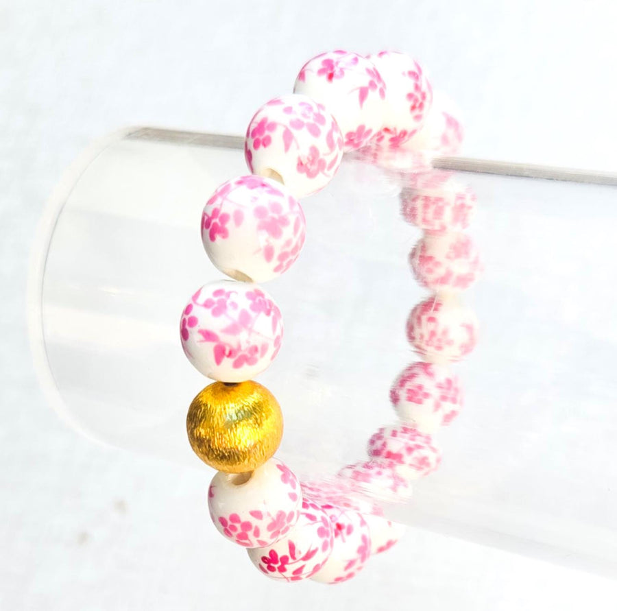 The Camille Chinoiserie Painted Bead Stretchy Bracelet with Brushed Gold Ball - Dark Pink Floral