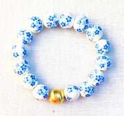 The Camille Chinoiserie Painted Bead Stretchy Bracelet with Brushed Gold Ball - Blue Two Tone Colorway